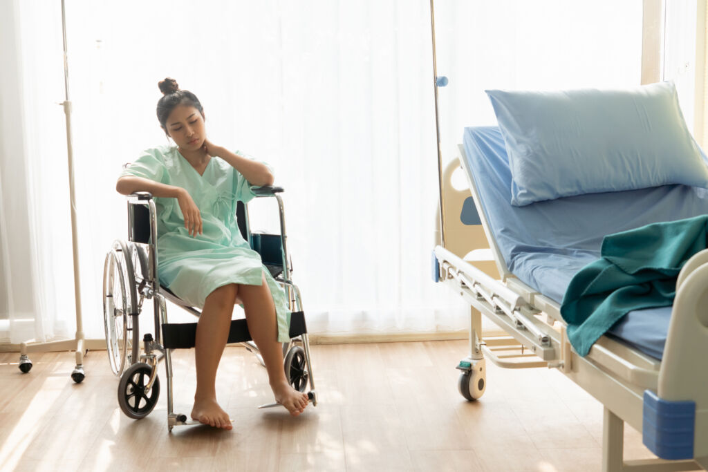 woman in wheelchair - medical malpractice concept image