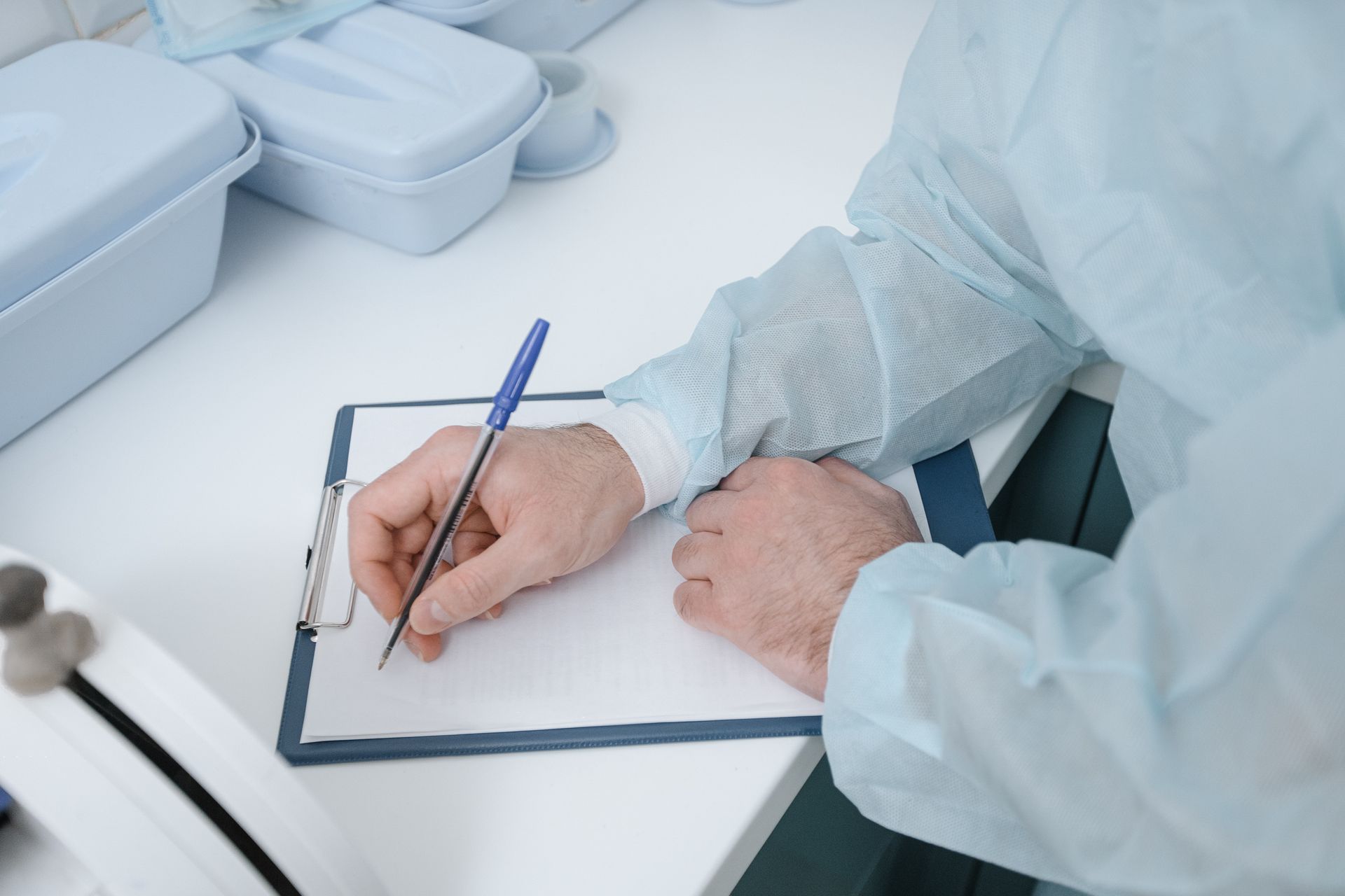 doctor-writing-down-on-a-clipboard